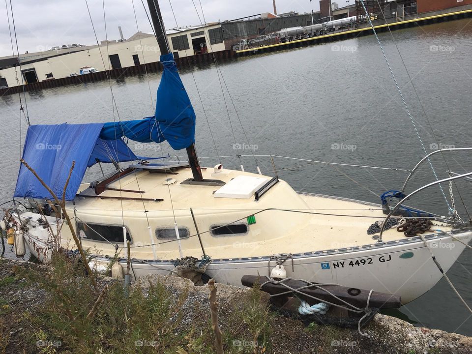 The “Salvation” seen from the shore at Newtown Creek in Long Island City, Queens, NY photographed on a partially overcast afternoon in 2018. Hypnotic Productions
