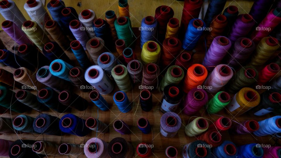 collection of sewing threads of various colors