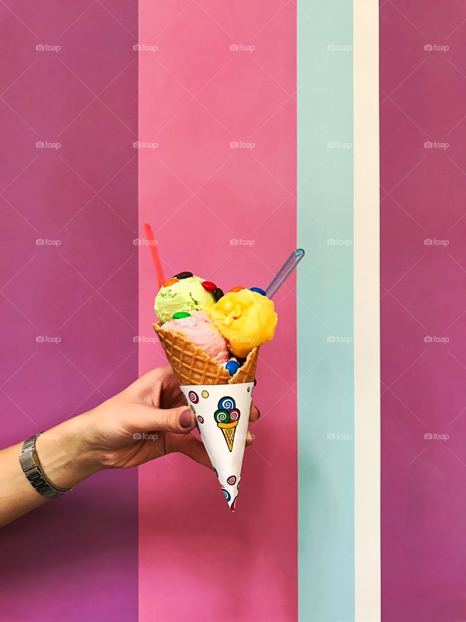 Ice cream cone on colorful pastel background 