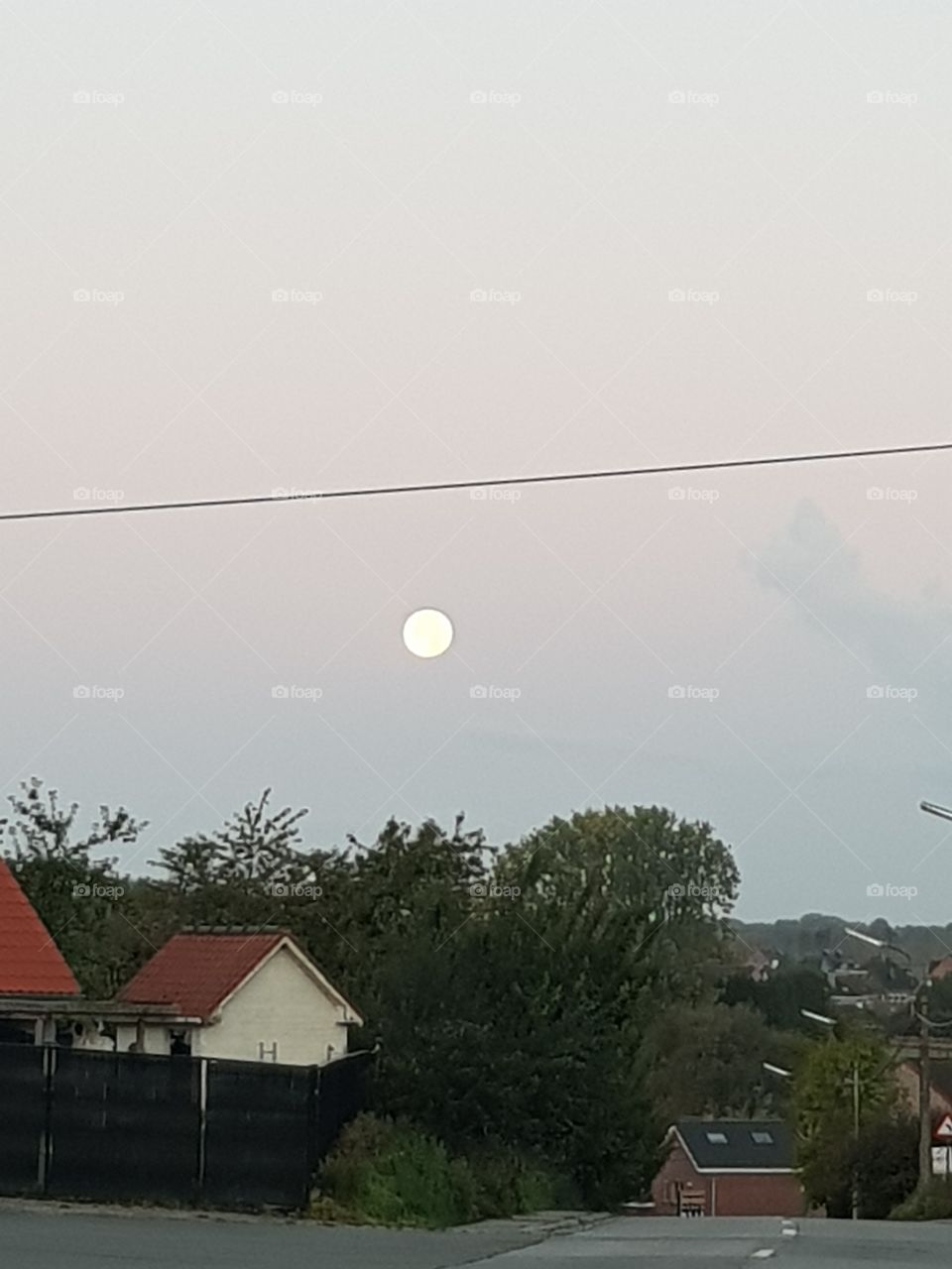 full moon above  street