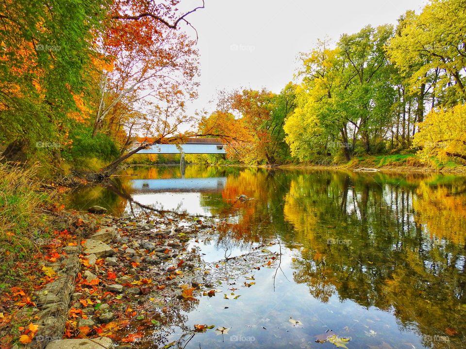 Beautiful fall day on the river at Potter’s bridge park in Indiana 