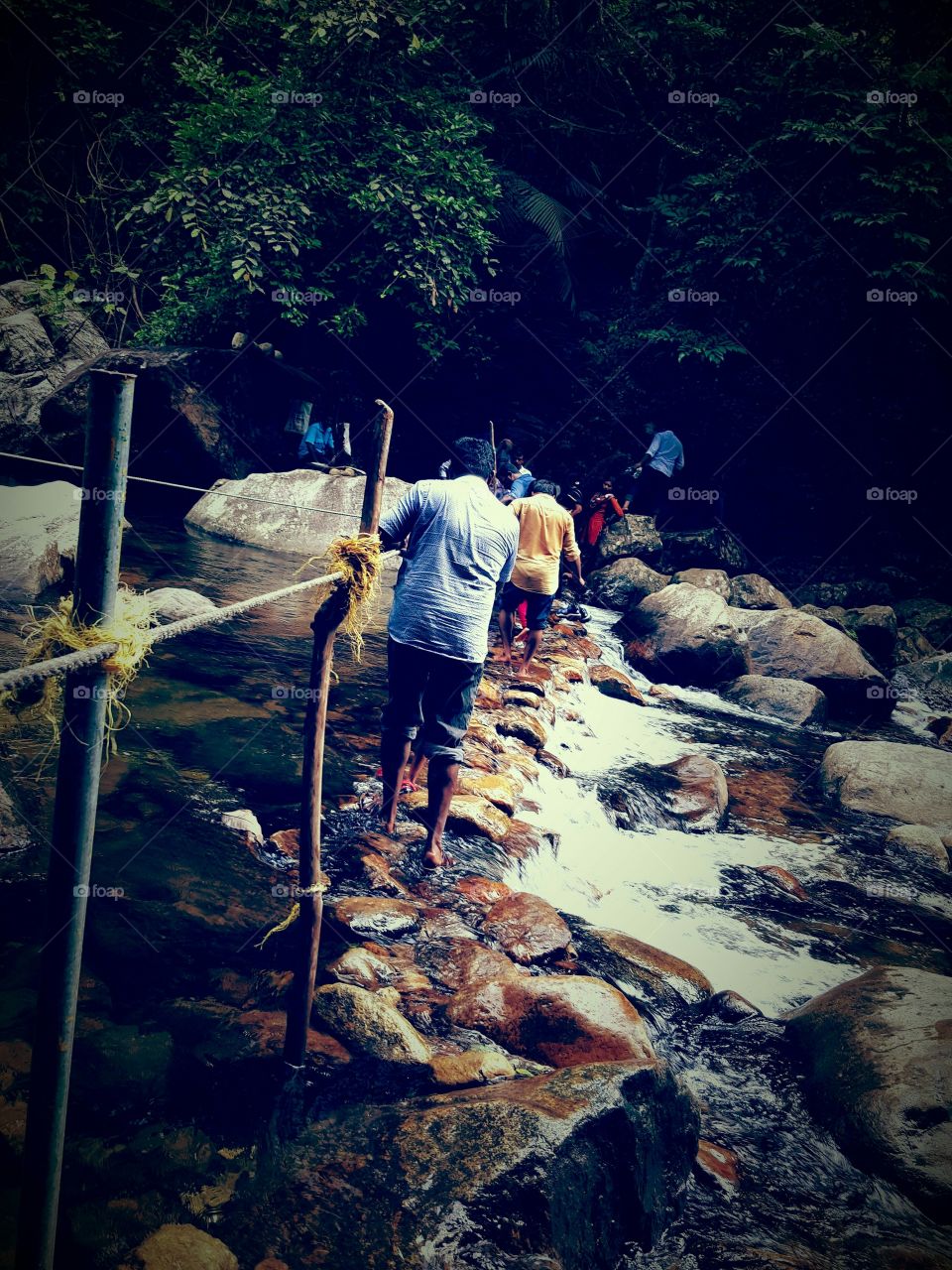 Crossing the Creek at Meenmutti Waterfalls