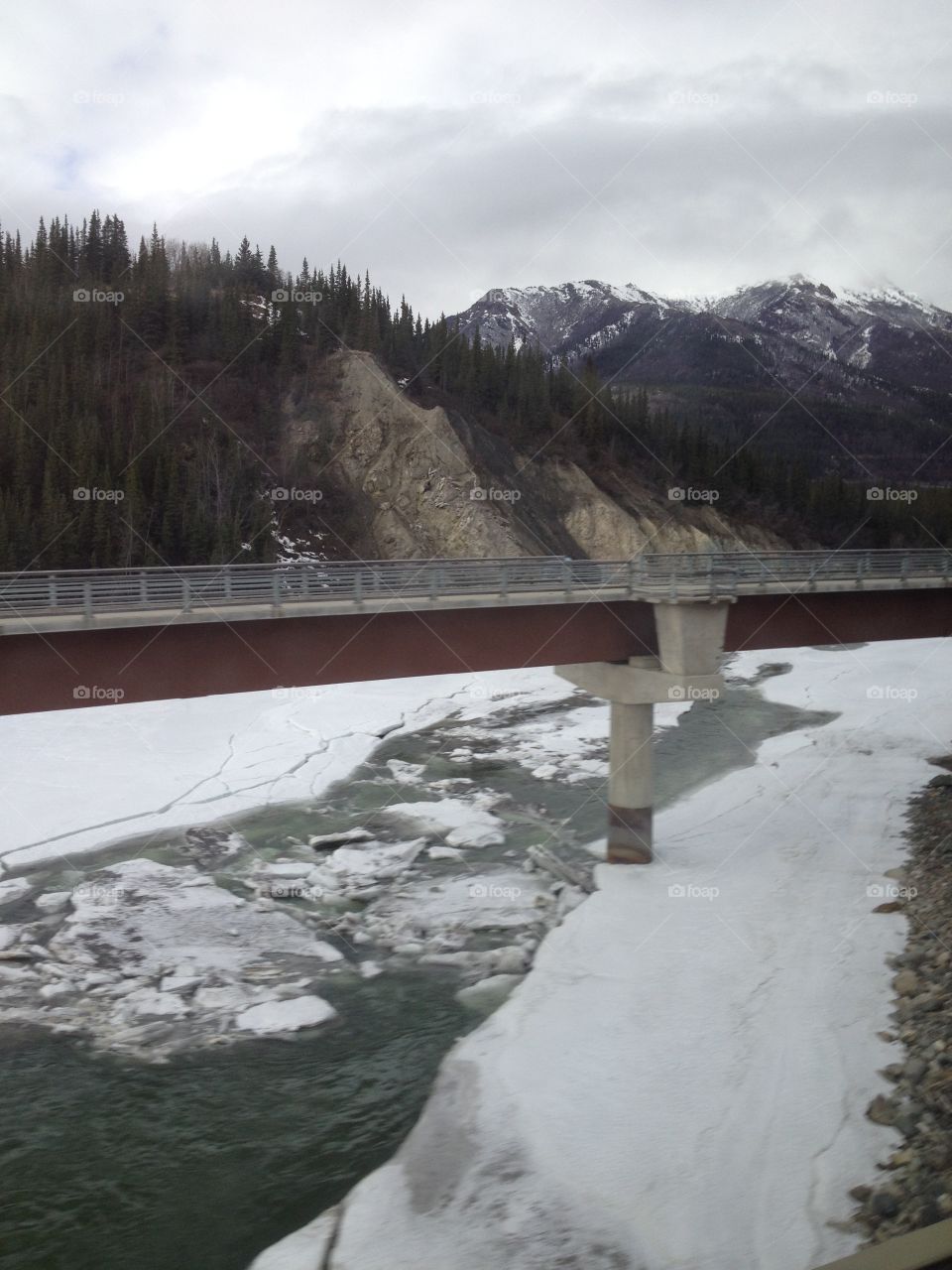 The end of winter in Alaska, ice breaking up in the river near Denali Park.