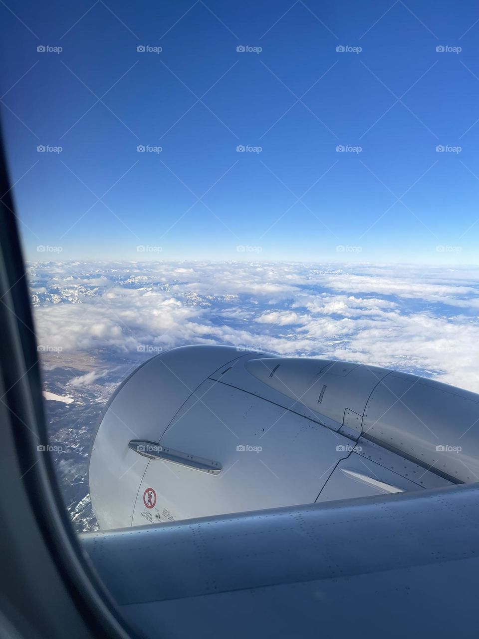 Airplane wing in sky 