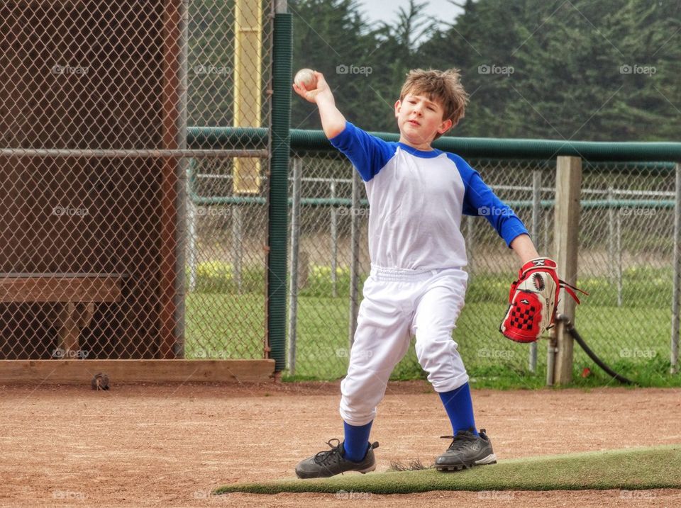 Boy Playing Little League Baseball

