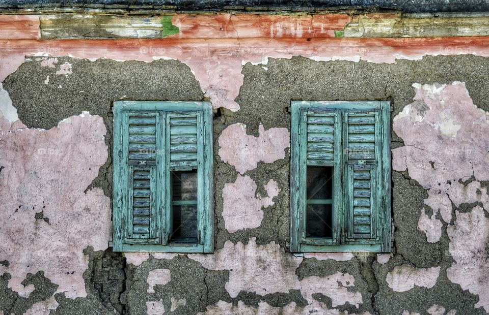 Broken and damaged wooden window