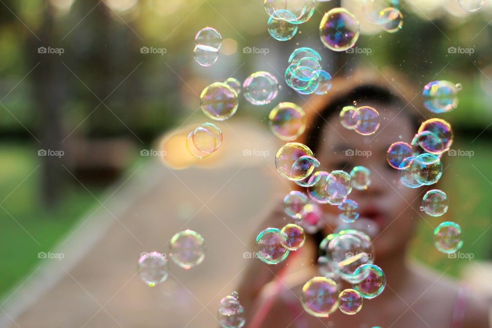 Girl playing bubble 