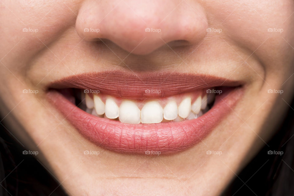 Big smile of beautuful woman, close up lips and teeth