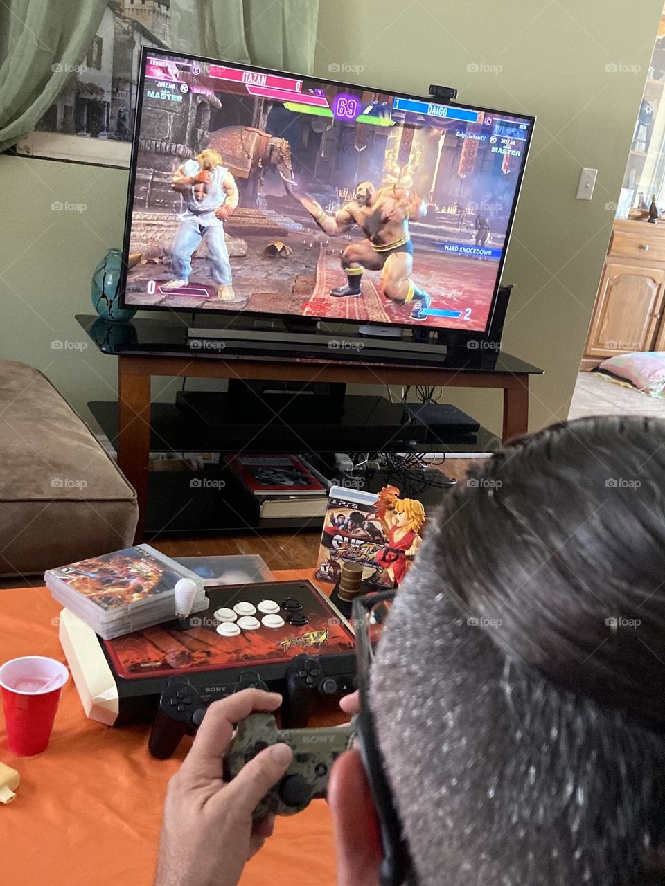 Man playing street fighter video game photography mission 