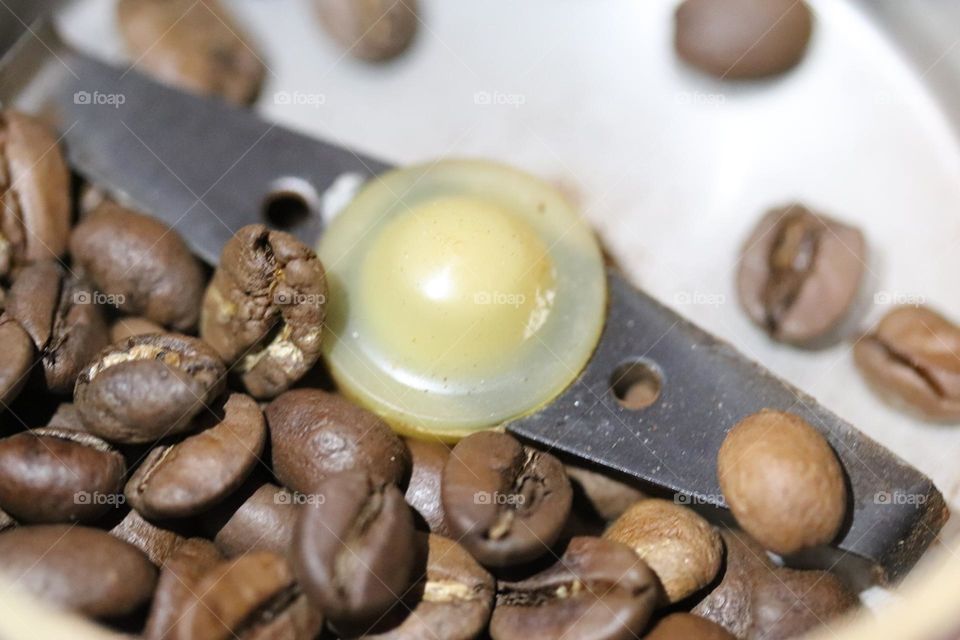 coffee beans in a coffee grinder