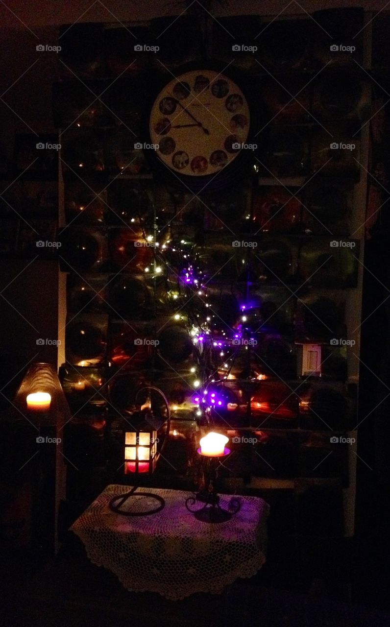 Lights on Wall for Atmosphere 

Interior Decoration - Covered a bare wall with hand made copper squares. Thread lights, candles, hang a personalized picture clock & "there you go" a soft lit wall to be proud of.