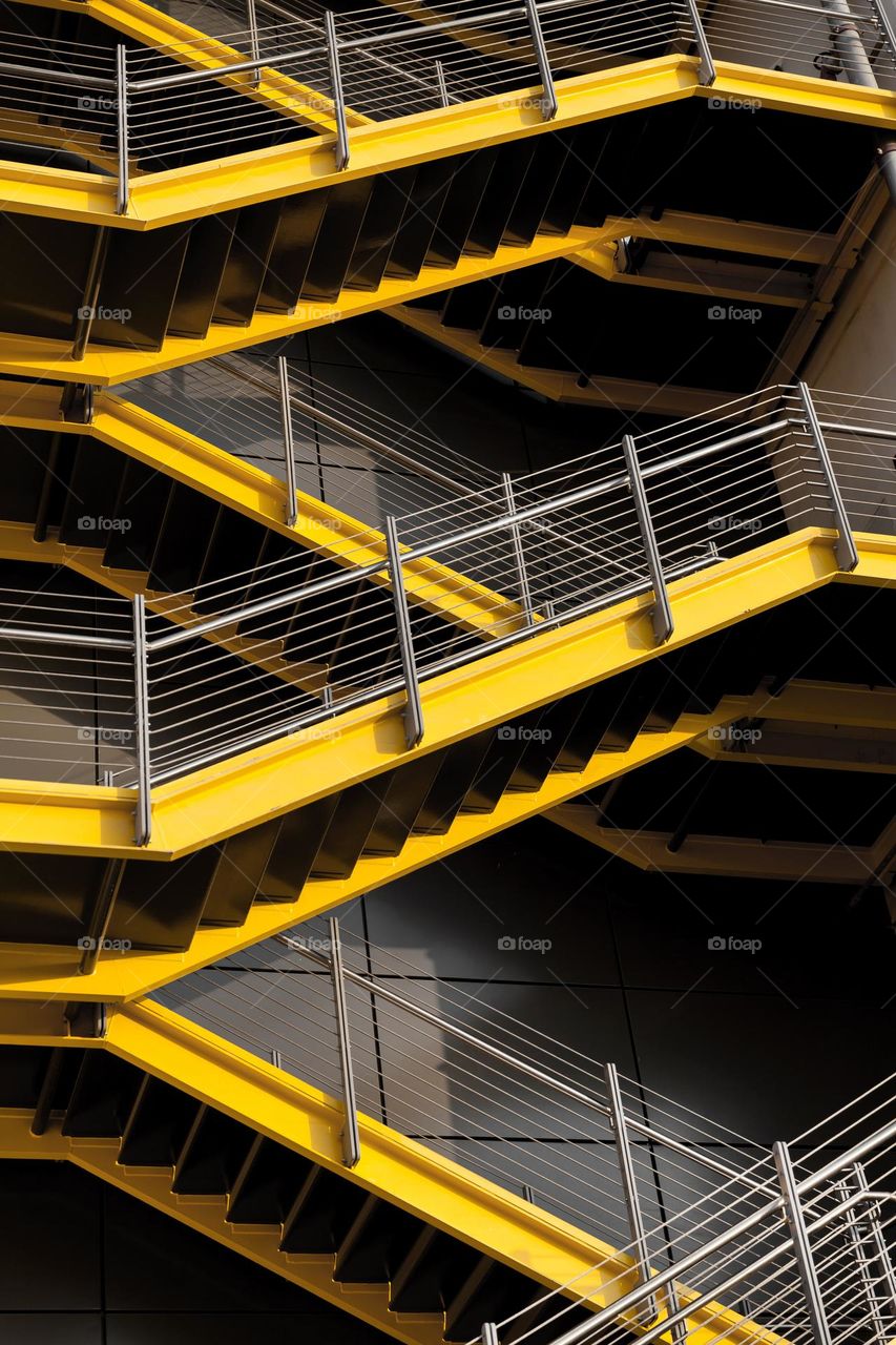 Industrial stairs: ultimate gray and yellow illuminating