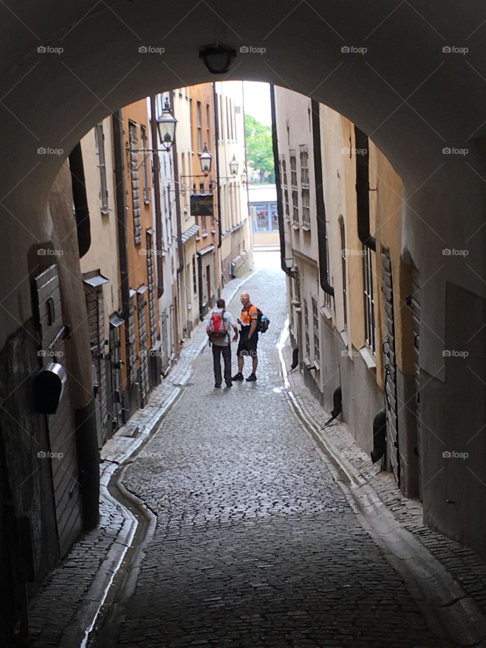 Tourists in Stockholm old town, Reading a map.
