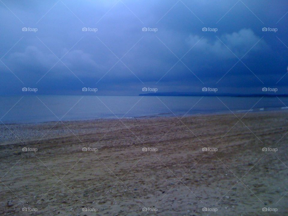 Camber sands beach with storm sky