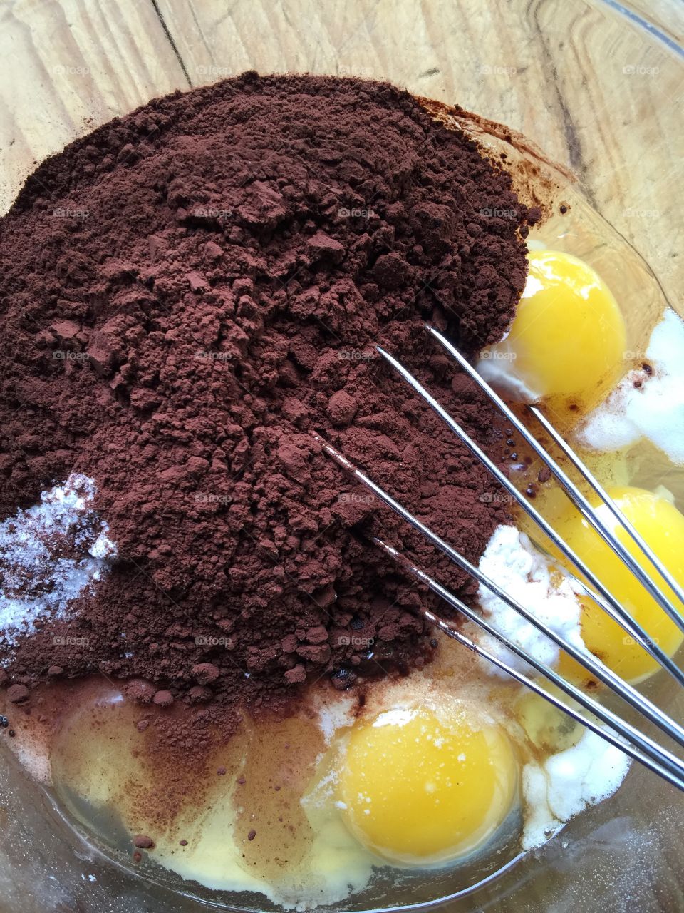 Mixing cocoa, flour and eggs