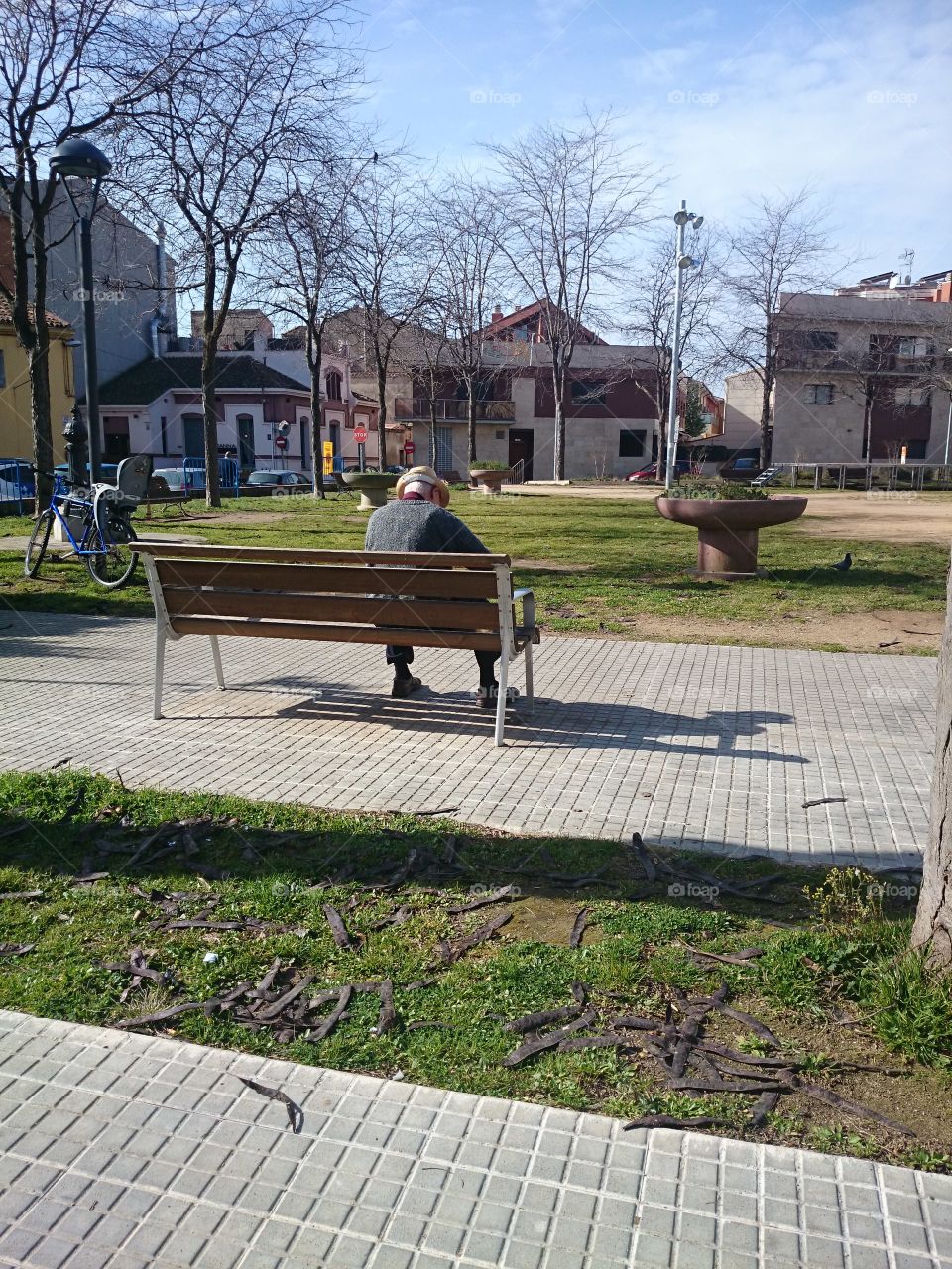 Old man sitting on bench