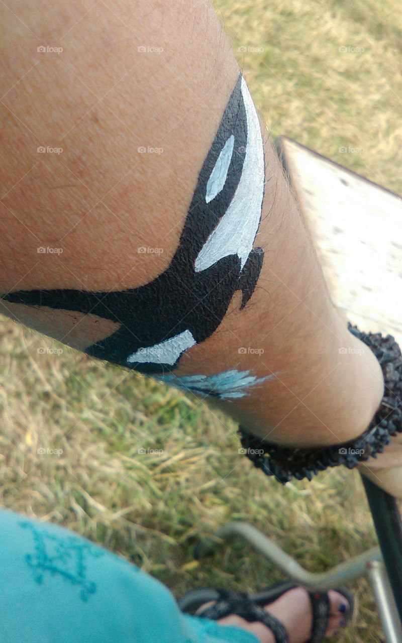 orca paint on arm