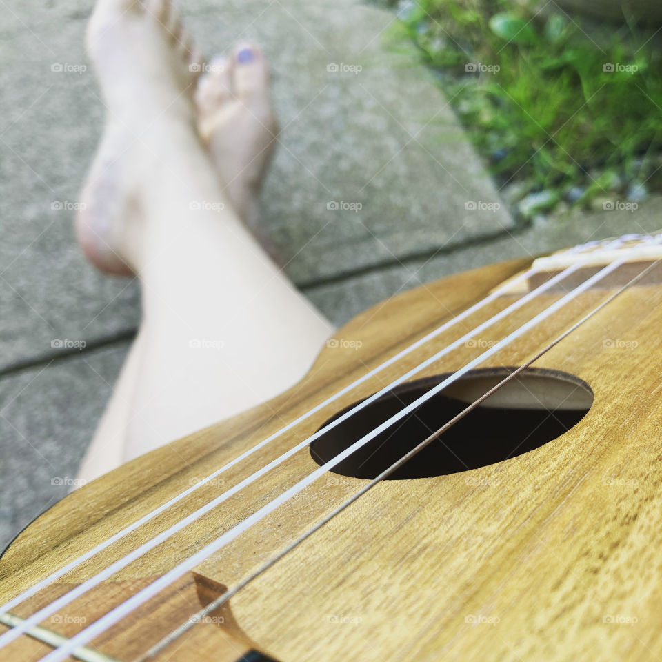 Playing the kala ukulele