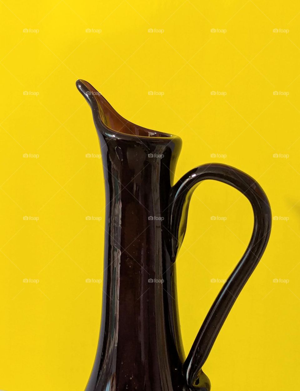 purple vase with yellow background