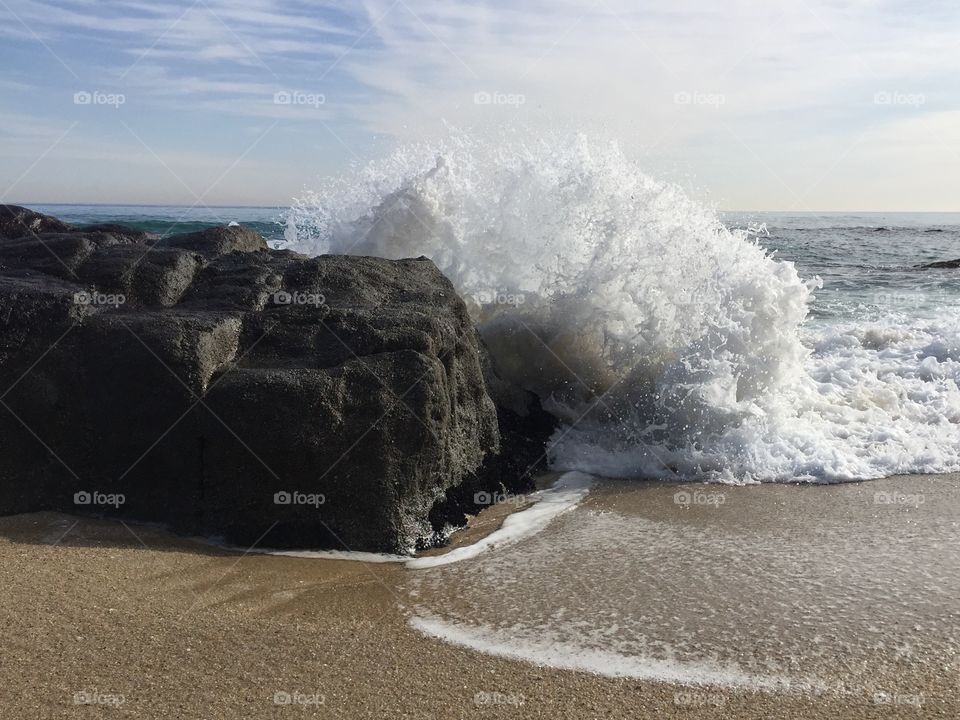 Wave Crashes on Rocks
