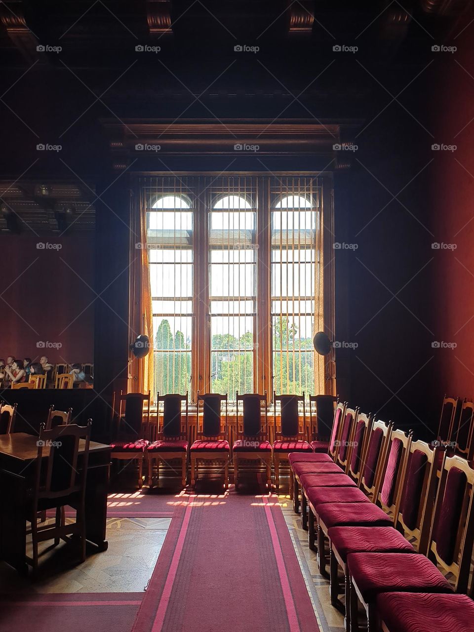 Square and rectangular shapes of window, chairs, table, mirror and of carpet on the floor in University in Chernivtsi