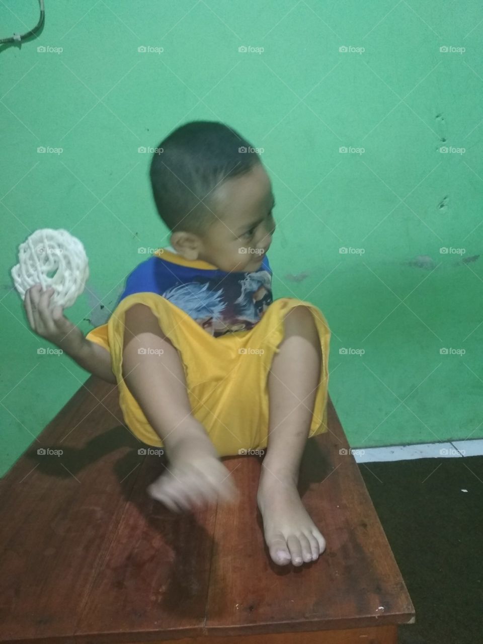 my son eating krupuk