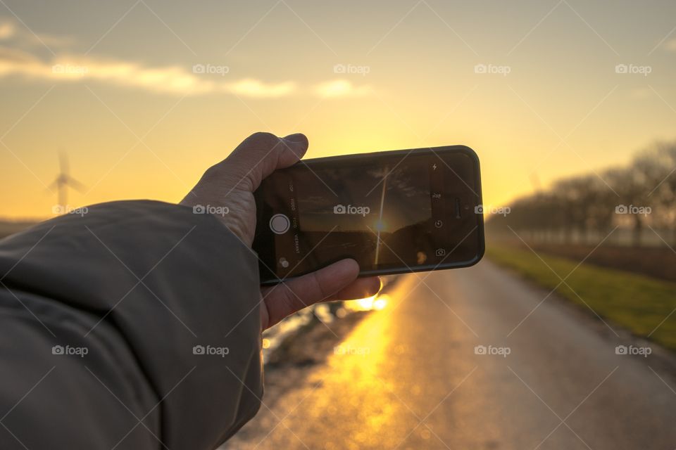 Taking a picture with my mobile of the stunning sunrise