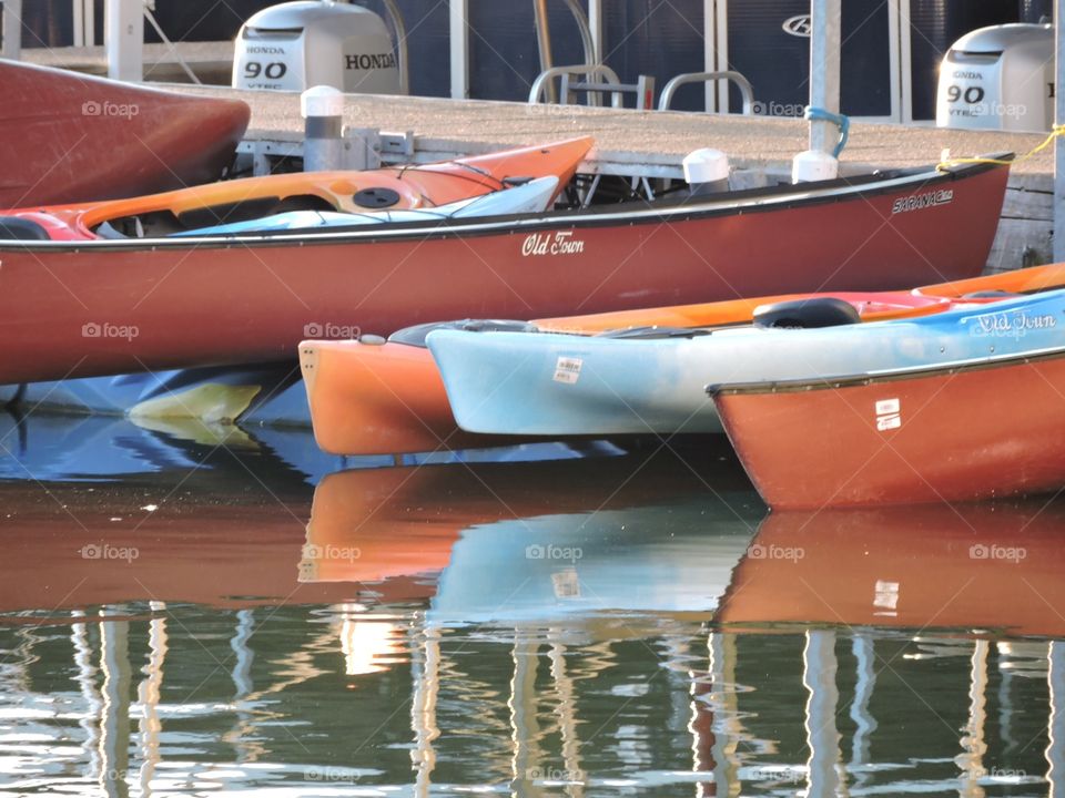 Canoes reflection on lake 