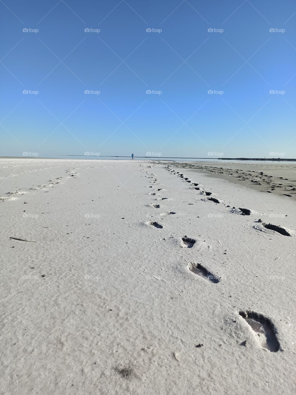 far

Traces stretching into the distance. Lake Sivash. Salty coast. Lonely man goes far