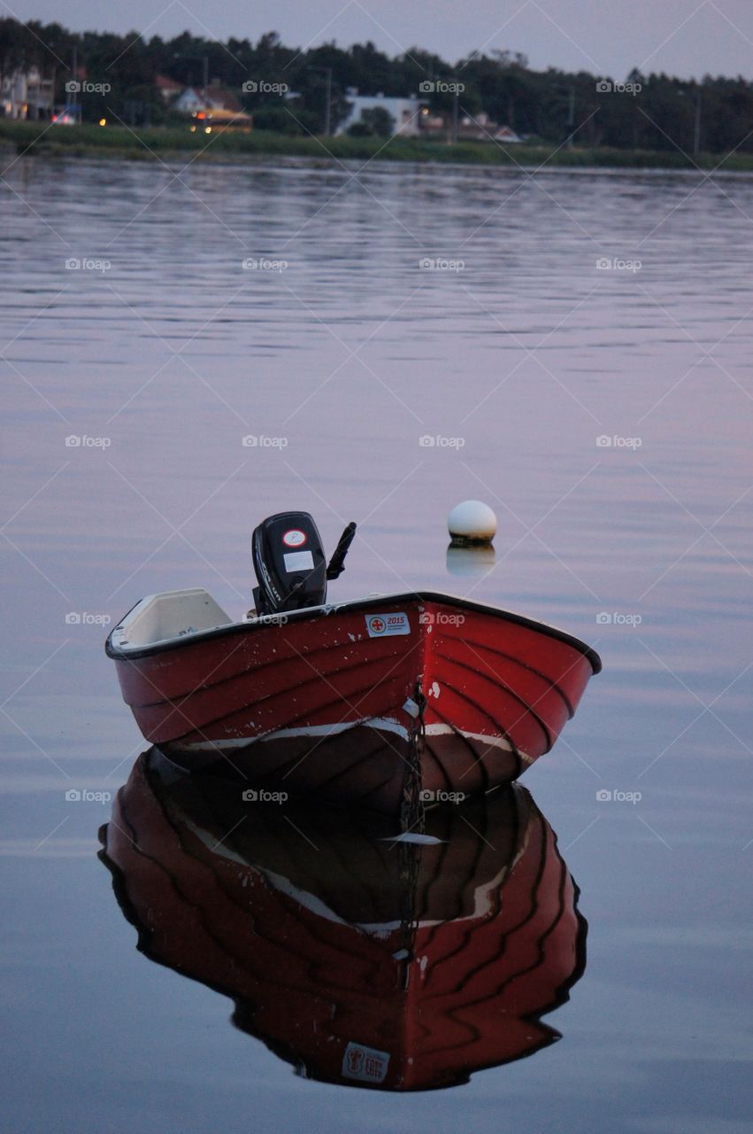 Red boat reflection