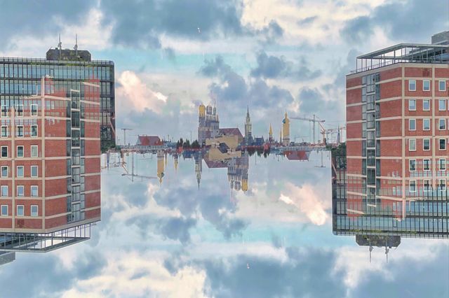 Cityscape with red house and cloudy sky artistically alienated by double exposure and reflection