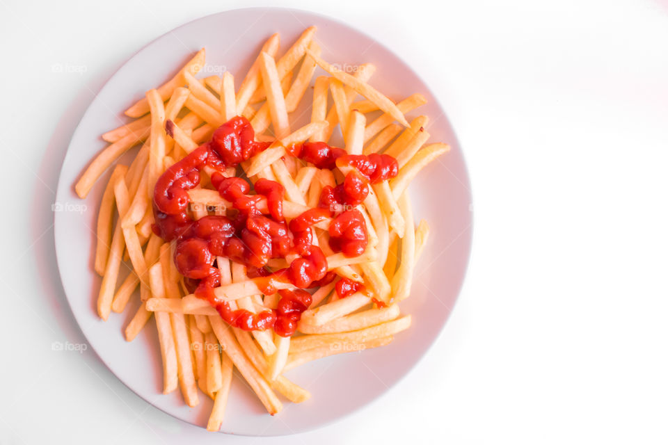 French Fries Potatoes With Red Sauce On Plate
