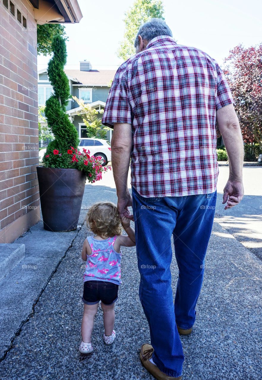 71 year old bone & prostate cancer patient from former Marine in Vietnam past holds 1 year old granddaughter's hand on the way to the donut shop.