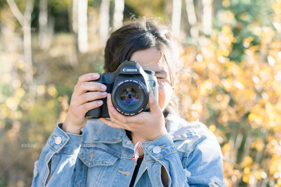 Young girl taking photos 