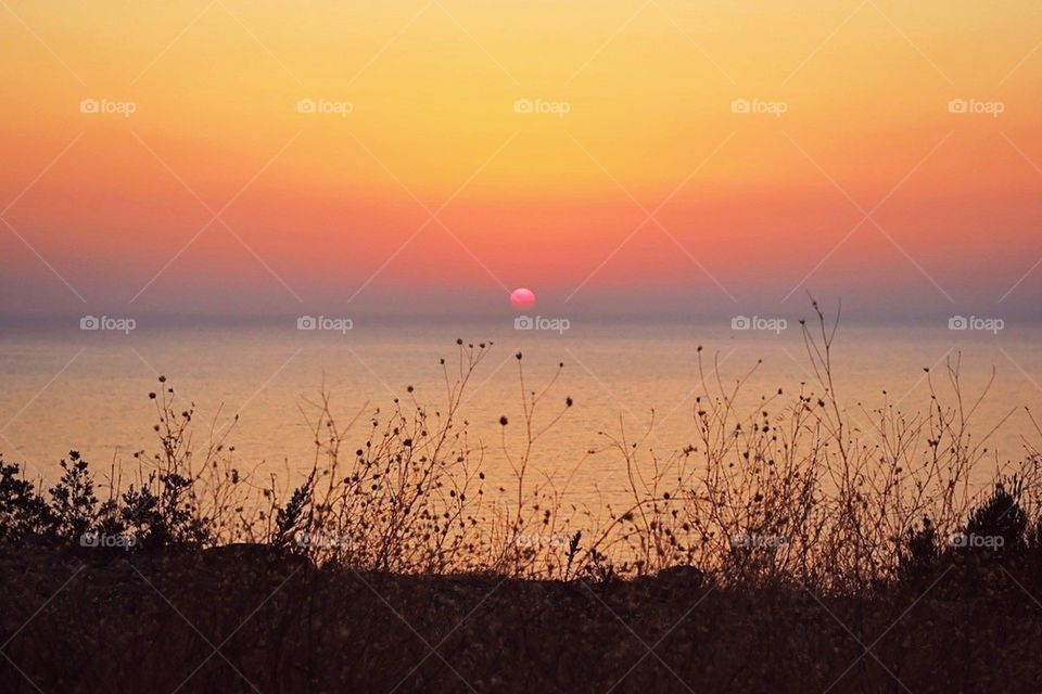 Sun setting over the Mediterranean sea