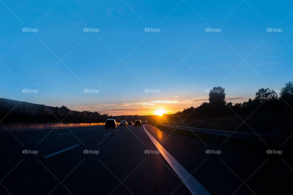 Traveling on highway at sunset 