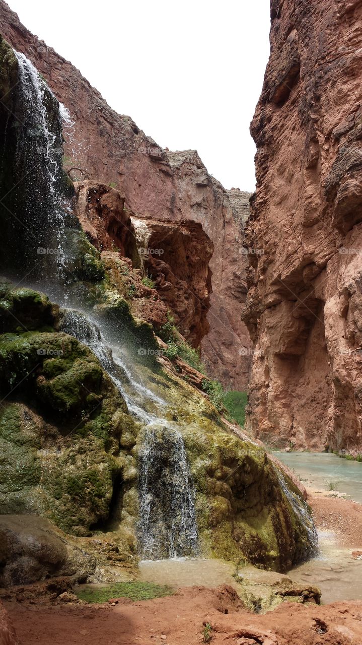 Hiking through the Grand Canyon with beautiful waterfalls, the Colorado River at it's best and tall colorful canyons