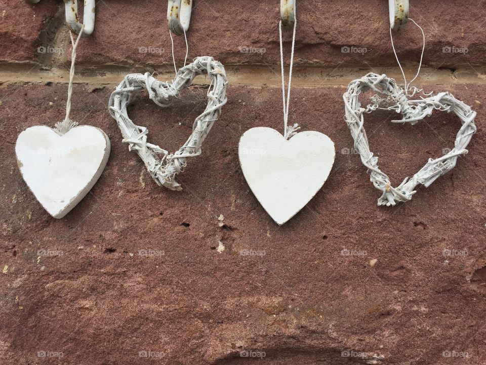 Wooden heart shape hanging on wall