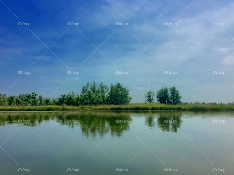 Natural Lakeside landscape reflected in the water 