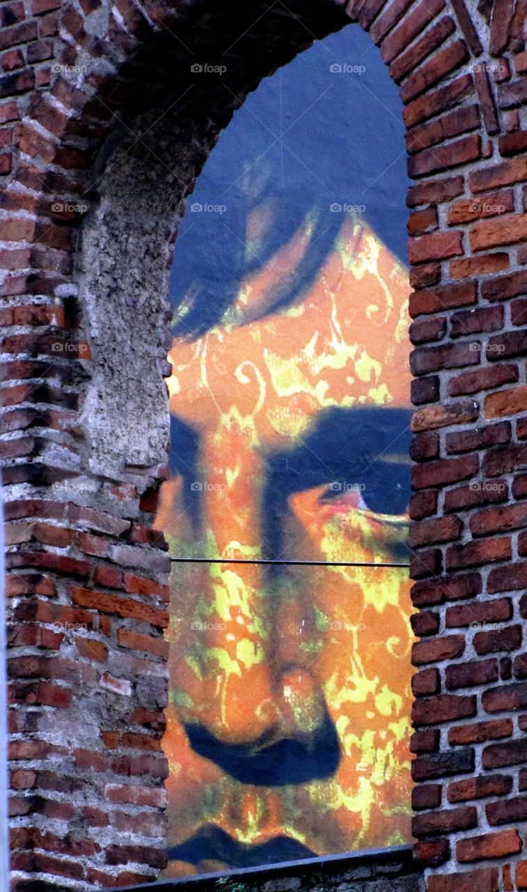 face into the window brick