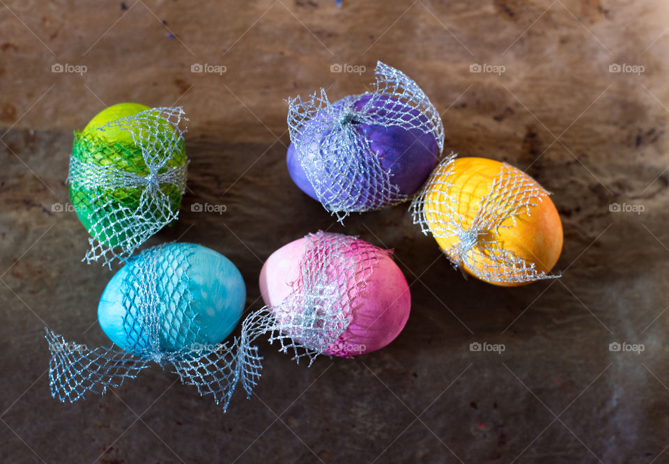 colorful Easter eggs on rustic background