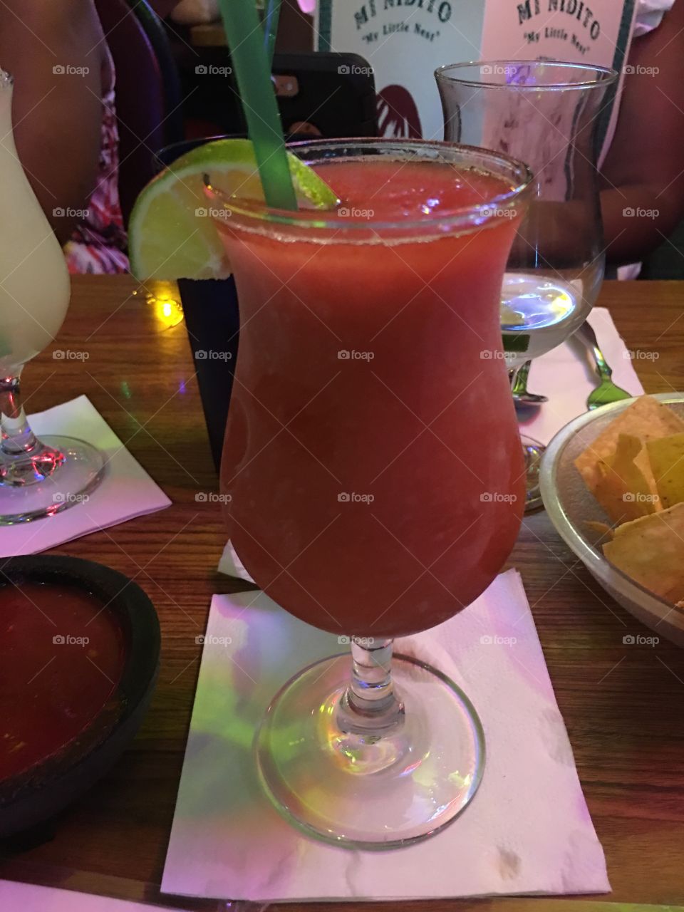 Delicious strawberry margarita with a lime Wedge