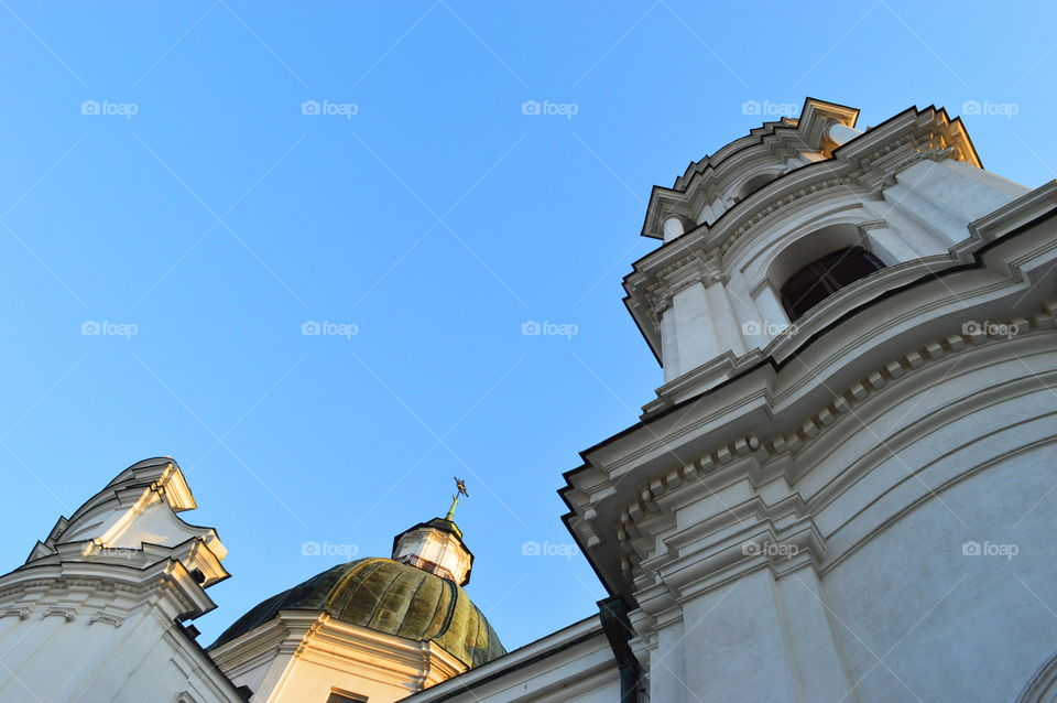 Clear blue sky above the historic basilica in Poland