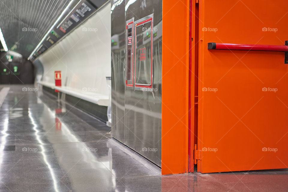 Orange and silver underground station