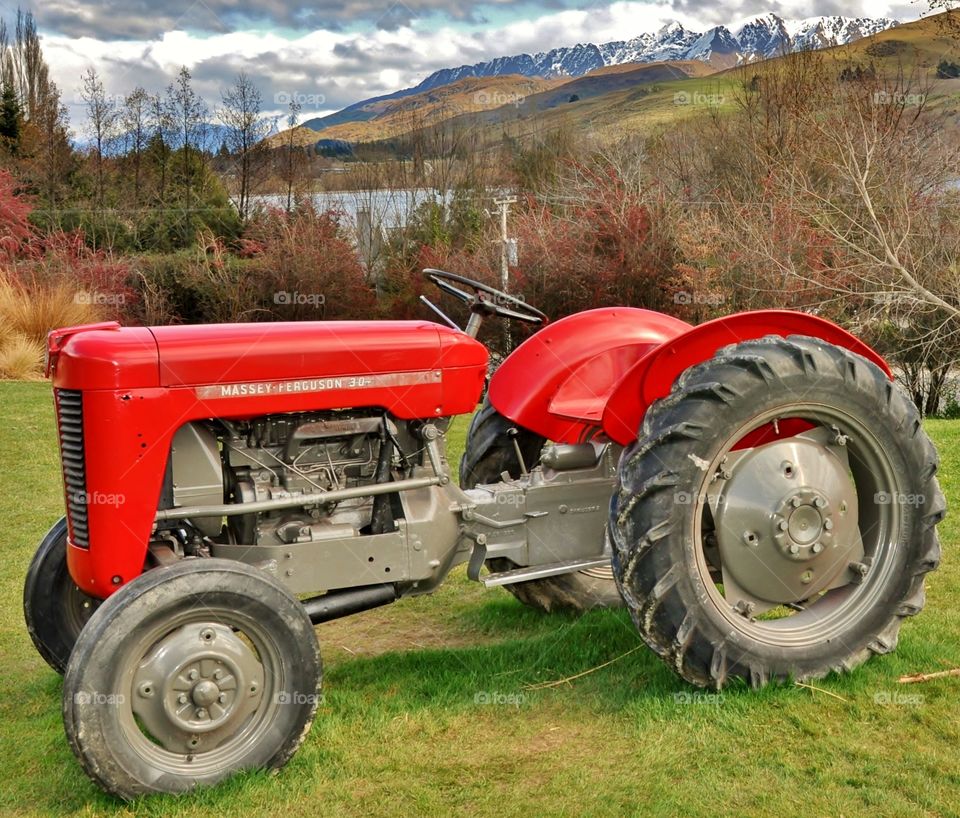 Red Tractor with Mountain views 