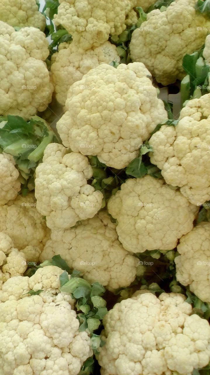 Abundence of white healthy fresh 
cauliflowers in market