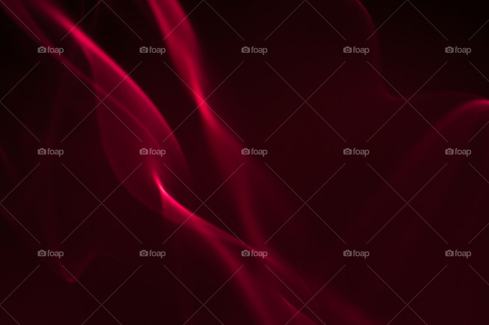 Smoke scented candles on a black background