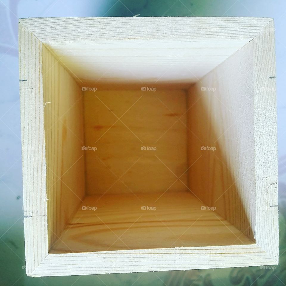 empty. a square wooden box that will become diy room lighting.