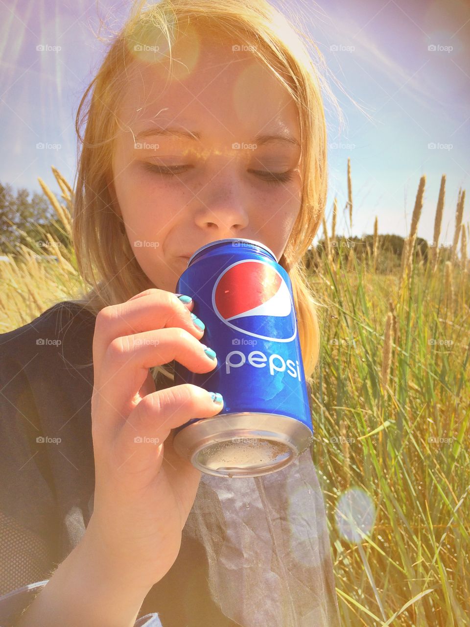 Girl drinking pepsi