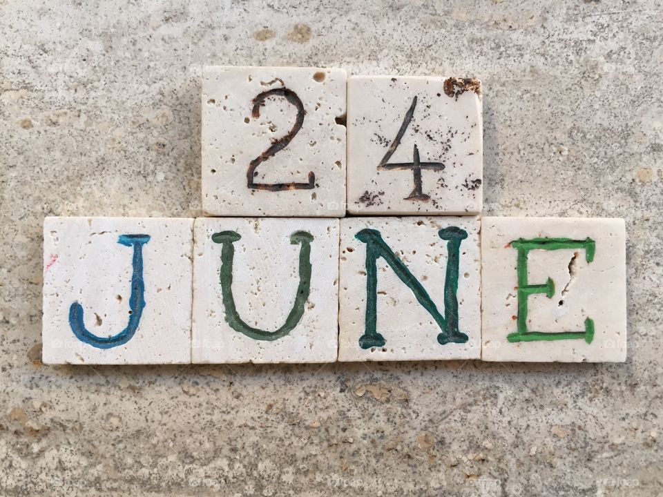 24th June,calendar date . Composition with carved travertine pieces of 24th June, calendar date